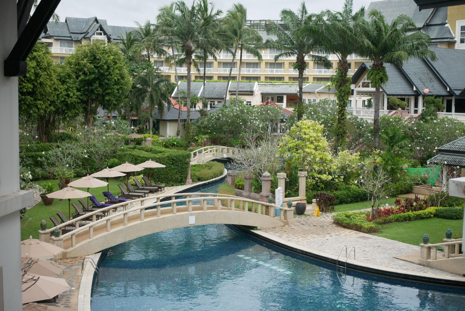 The 300m long free-form pool winds its way through the property