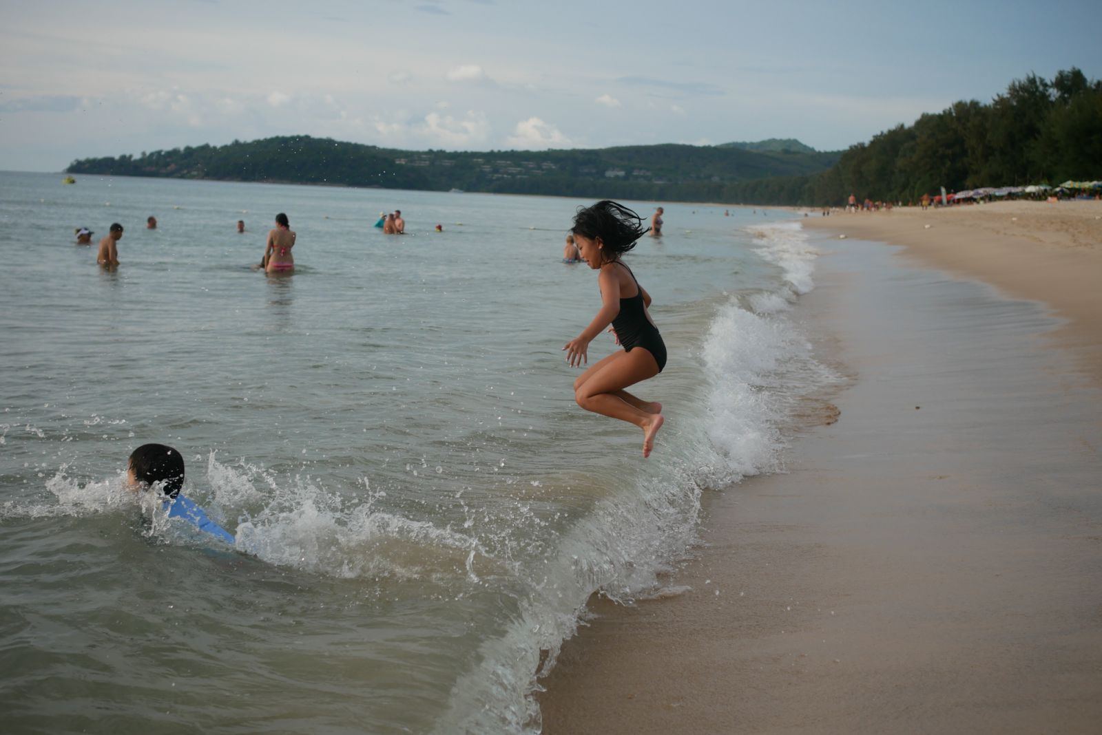 Kids playing in the surf