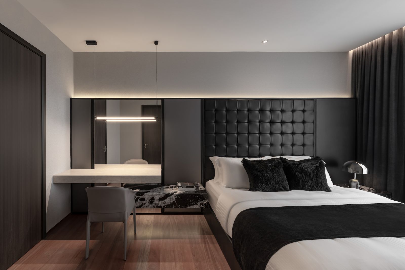 The textured headboard completes this handsome bedroom