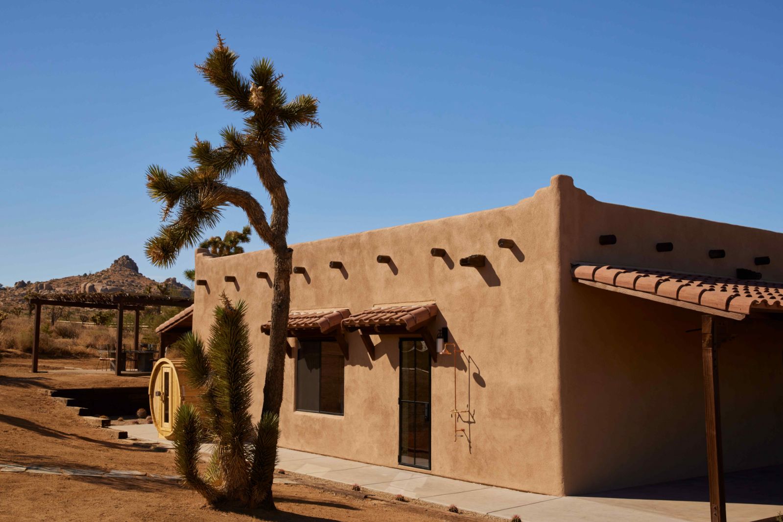 Traditionally built with flat roofs and rounded exterior corners made of mud puddles, the residence had a stucco exterior instead
