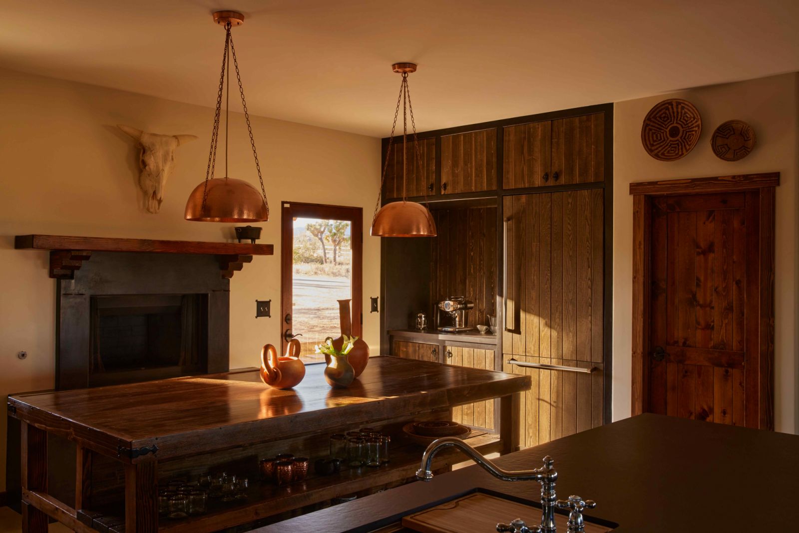 The moody darks and blacks of the open kitchen area