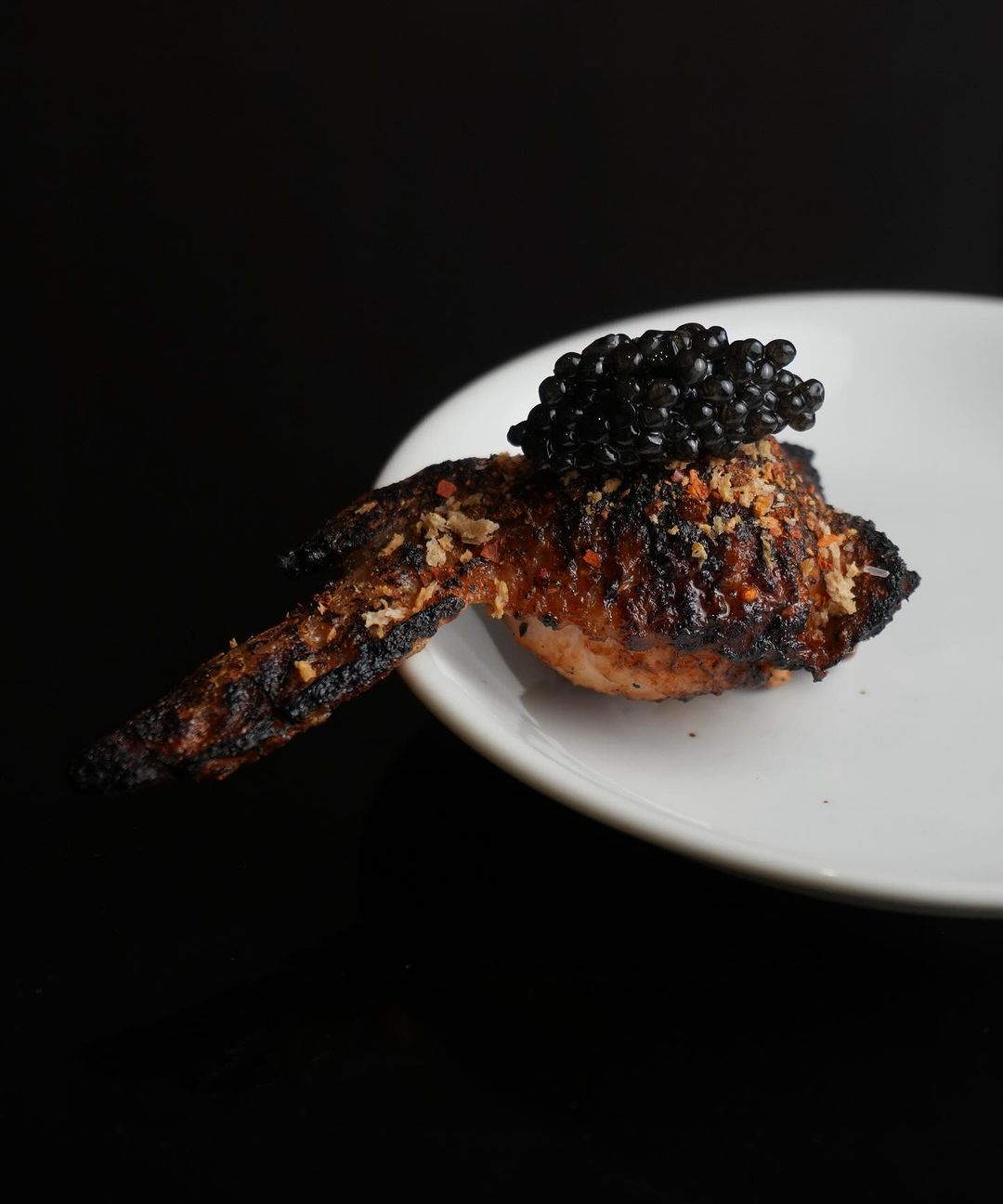 Stuffed percik wings with sturgeon caviar (Photo: Instagram / @carbon.kl)