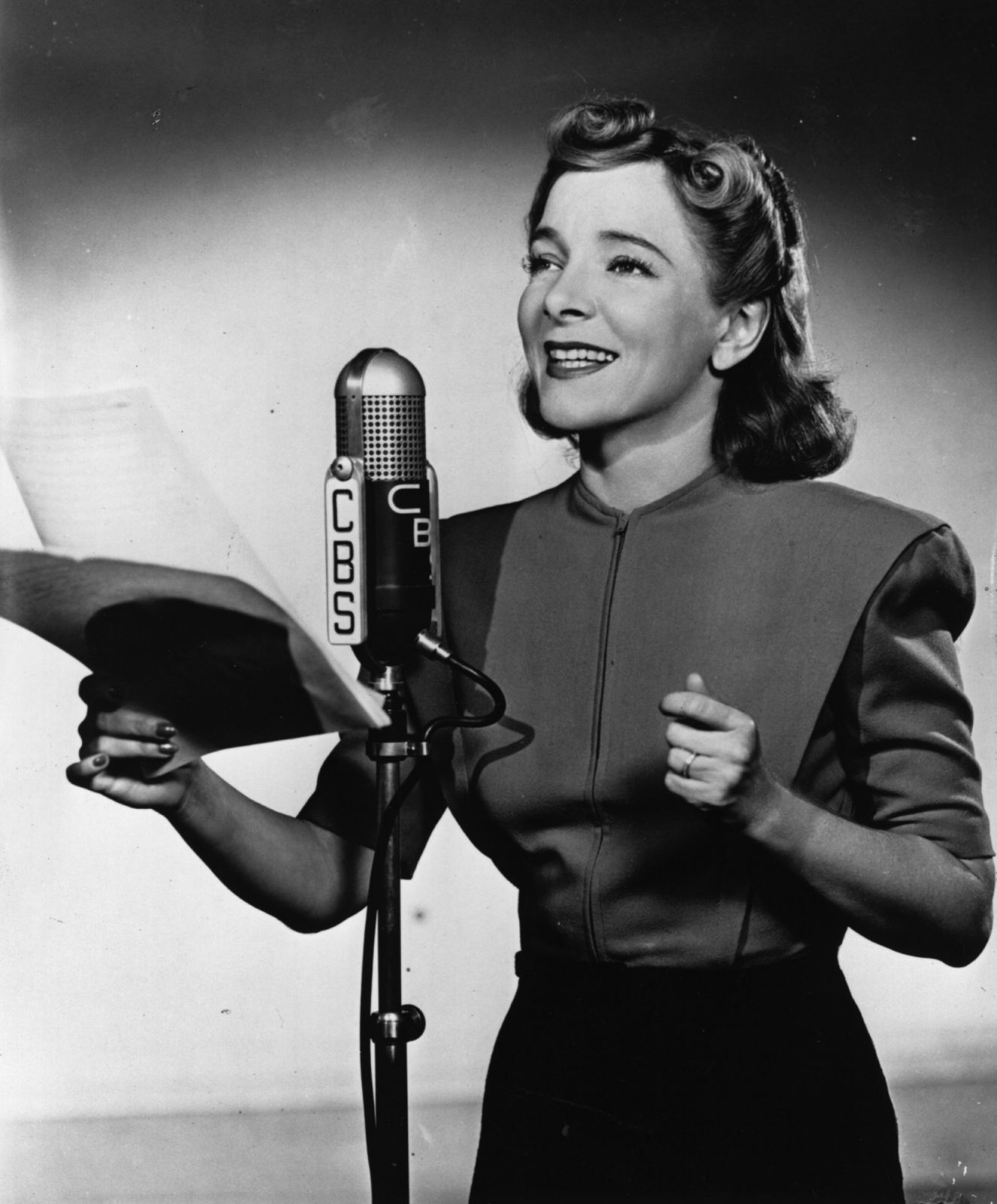 circa 1935: American stage actress Helen Hayes reads for a CBS broadcast. (Photo by Fox Photos/Getty Images)