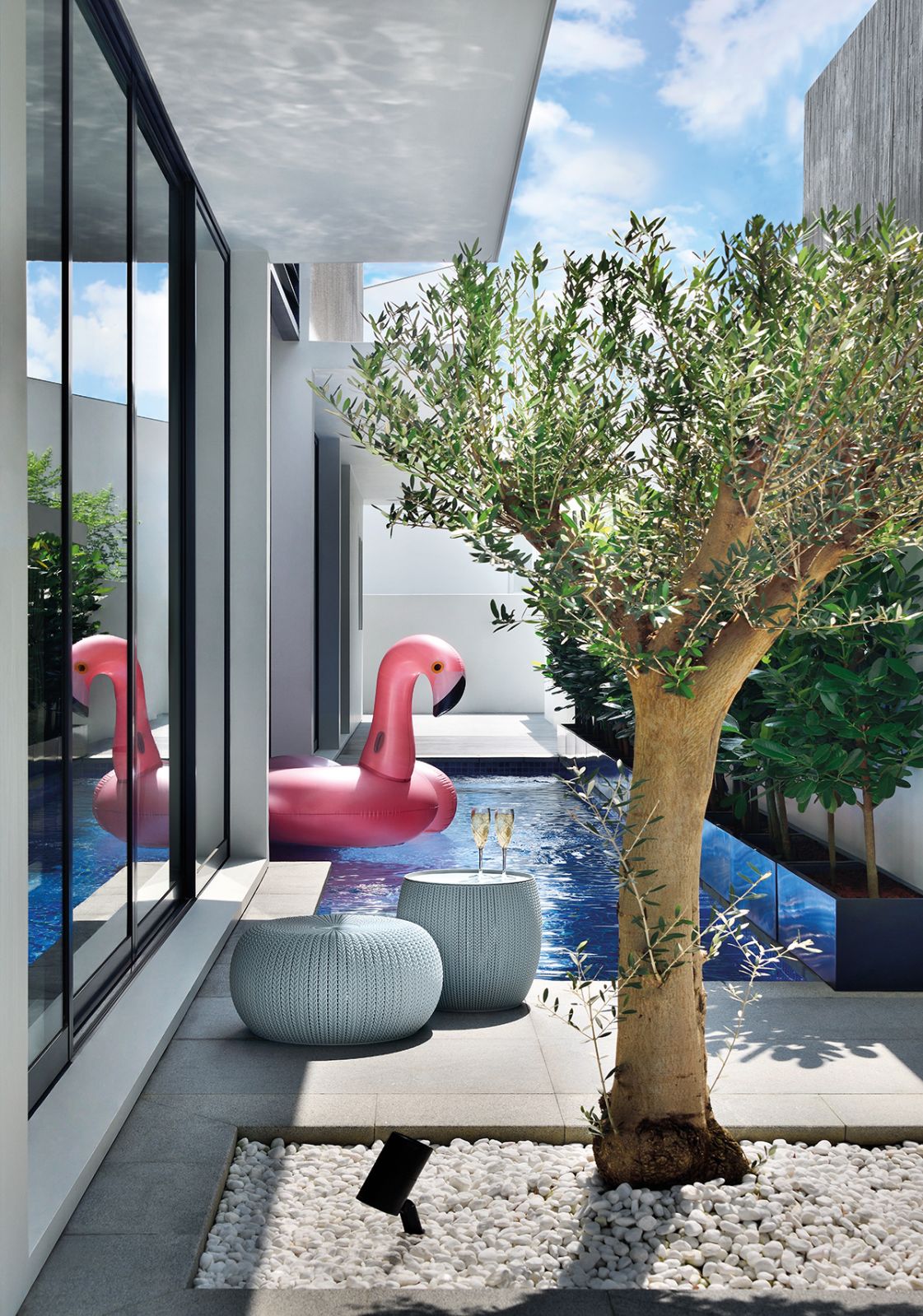 A flamingo-shaped float brings a playful touch to the pool