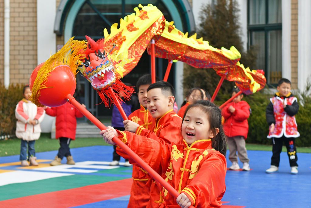 YANTAI, CHINA - JANUARY 16: Children perform dragon dance at a kindergarten ahead of the Chinese New Year, the Year of the Dragon, on January 16, 2024 in Yantai, Shandong Province of China. (Photo by Sun Wentan/VCG via Getty Images)