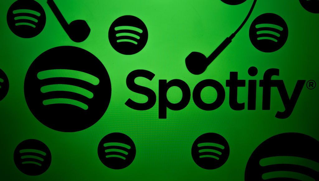 ANKARA, TURKIYE - DECEMBER 13: In this photo illustration, a screen displays the logos of 'Spotify' and a pair of earphones is seen in Ankara, Turkiye on December 13, 2023. (Photo by Didem Mente/Anadolu via Getty Images)
