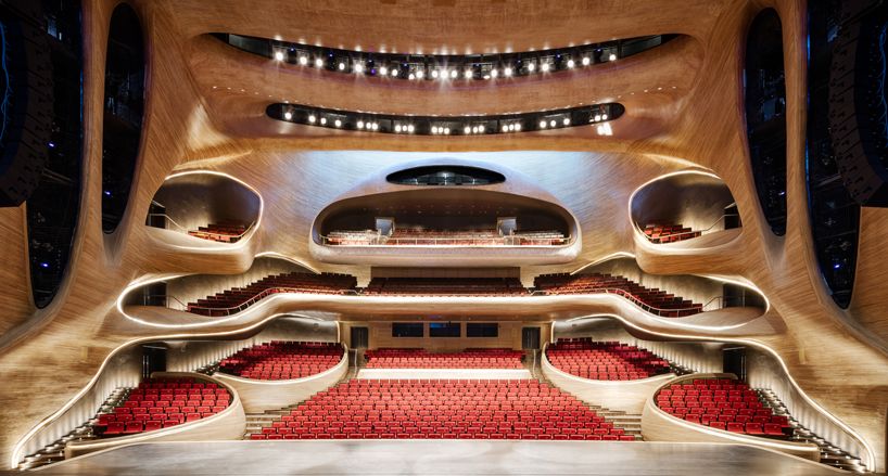 The curved lines of the main amphitheatre made from Manchurian Ash wood (Photo: Instagram / @madarchitects)