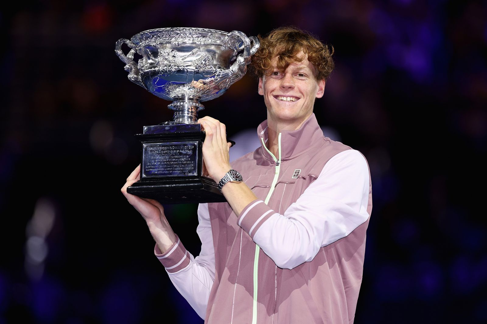 MELBOURNE, AUSTRALIA - JANUARY 28: Jannik Sinner of Italy poses with the Norman Brookes Challenge Cup during the official presentation after their Men's Singles Final match against Daniil Medvedev during the 2024 Australian Open at Melbourne Park on January 28, 2024 in Melbourne, Australia. (Photo by Cameron Spencer/Getty Images)