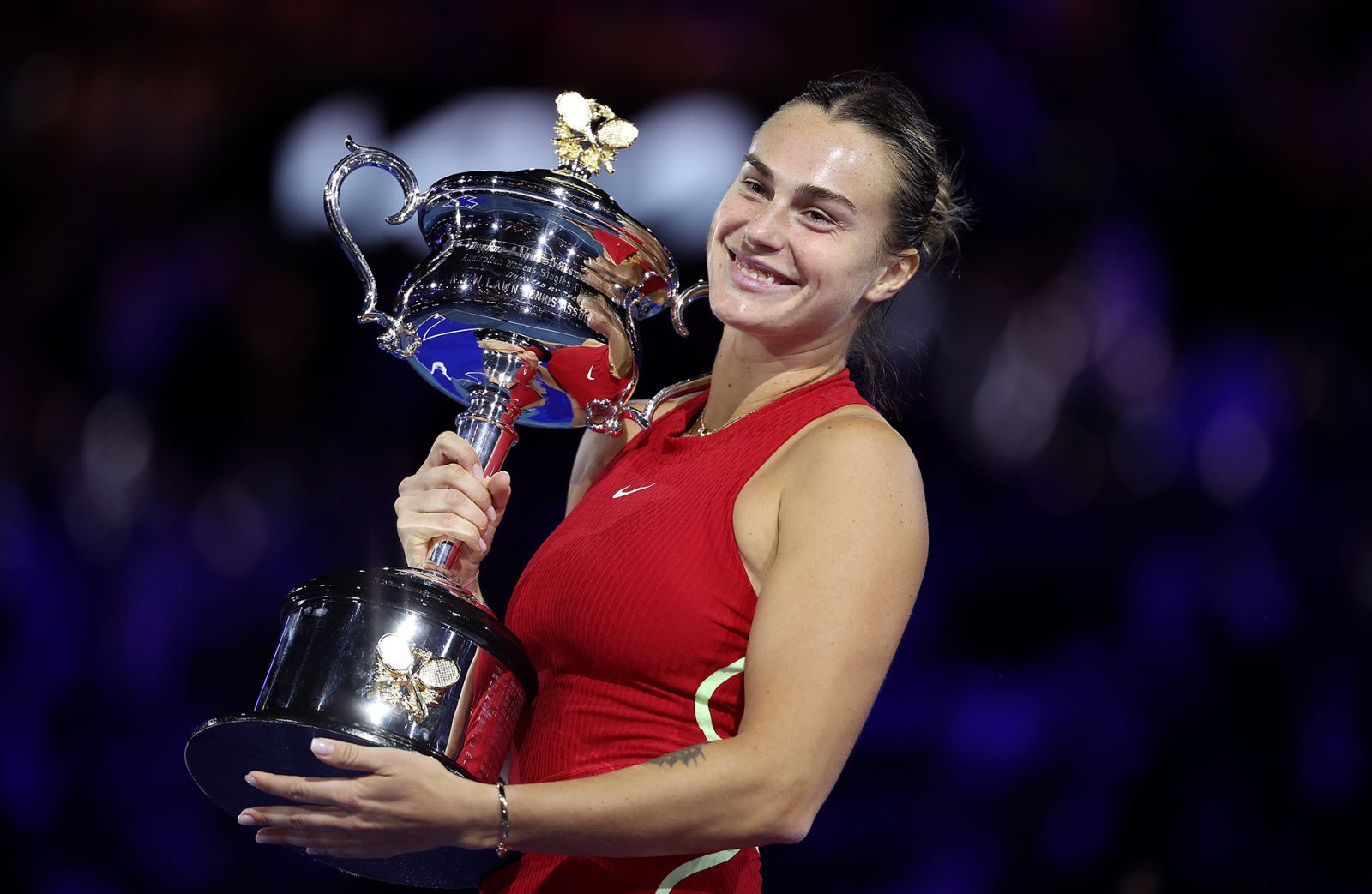MELBOURNE, AUSTRALIA - JANUARY 27: Aryna Sabalenka poses with the Daphne Akhurst Memorial Cup after the the Women's Singles Final match between Qinwen Zheng of China and Aryna Sabalenka during the 2024 Australian Open at Melbourne Park on January 27, 2024 in Melbourne, Australia. (Photo by Julian Finney/Getty Images)