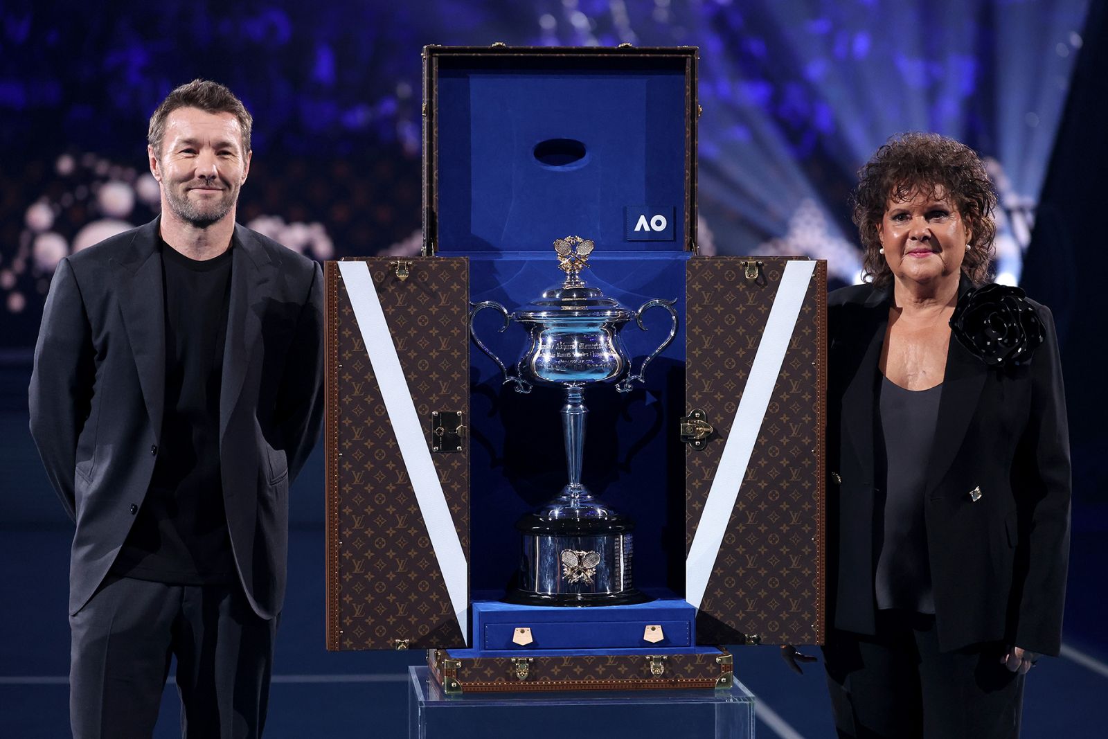 MELBOURNE, AUSTRALIA - JANUARY 27: The Daphne Akhurst Memorial Cup arrives in the Louis Vuitton trophy trunk, as Joel Edgerton and Evonne Goolagong Cawley reveal the trophy prior to the Women's Singles Final match between Qinwen Zheng of China and Aryna Sabalenka during the 2024 Australian Open at Melbourne Park on January 27, 2024 in Melbourne, Australia. (Photo by Julian Finney/Getty Images)