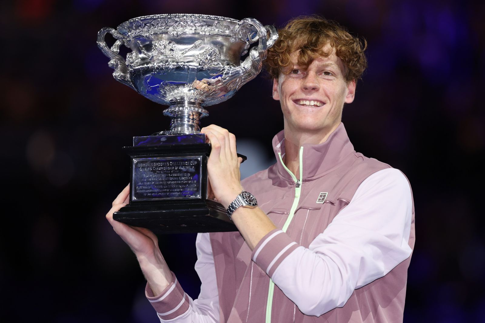 MELBOURNE, AUSTRALIA - JANUARY 28: Jannik Sinner of Italy poses with the Norman Brookes Challenge Cup during the official presentation after their Men's Singles Final match against Daniil Medvedev during the 2024 Australian Open at Melbourne Park on January 28, 2024 in Melbourne, Australia. (Photo by Cameron Spencer/Getty Images)