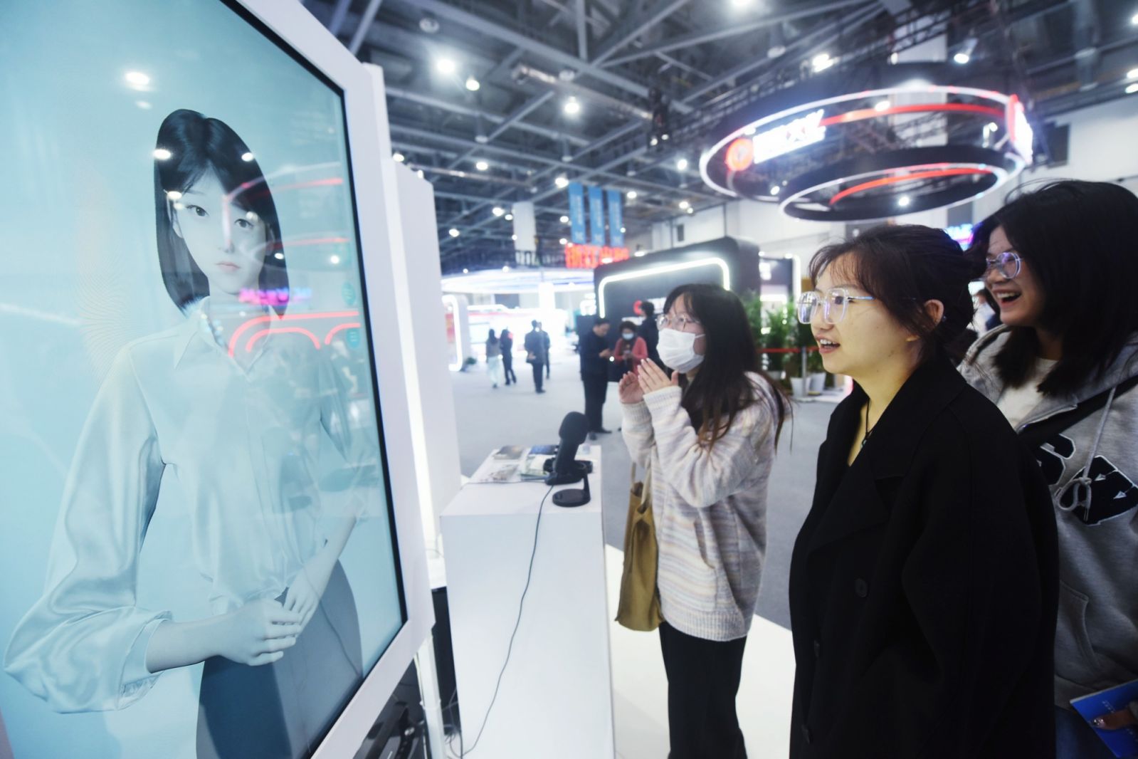 Visitors are interacting with AI digital people at a conference in China (Photo: Getty Images)