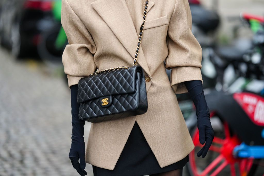 PARIS, FRANCE - JANUARY 25: Angela Gonzalez wears a beige oversized blazer jacket black gloves, a leather Chanel bag, outside Ashi Studio, during the Haute Couture Spring/Summer 2024 as part of Paris Fashion Week on January 25, 2024 in Paris, France. (Photo by Edward Berthelot/Getty Images)