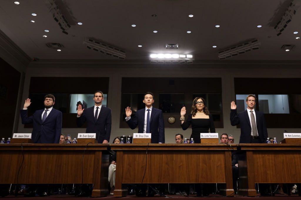 WASHINGTON, DC - JANUARY 31:  (L-R) Jason Citron, CEO of Discord, Evan Spiegel, CEO of Snap, Shou Zi Chew, CEO of TikTok, Linda Yaccarino, CEO of X, and Mark Zuckerberg, CEO of Meta are sworn in as they testify before the Senate Judiciary Committee at the Dirksen Senate Office Building on January 31, 2024 in Washington, DC. The committee heard testimony from the heads of the largest tech firms on the dangers of child sexual exploitation on social media. (Photo by Alex Wong/Getty Images)