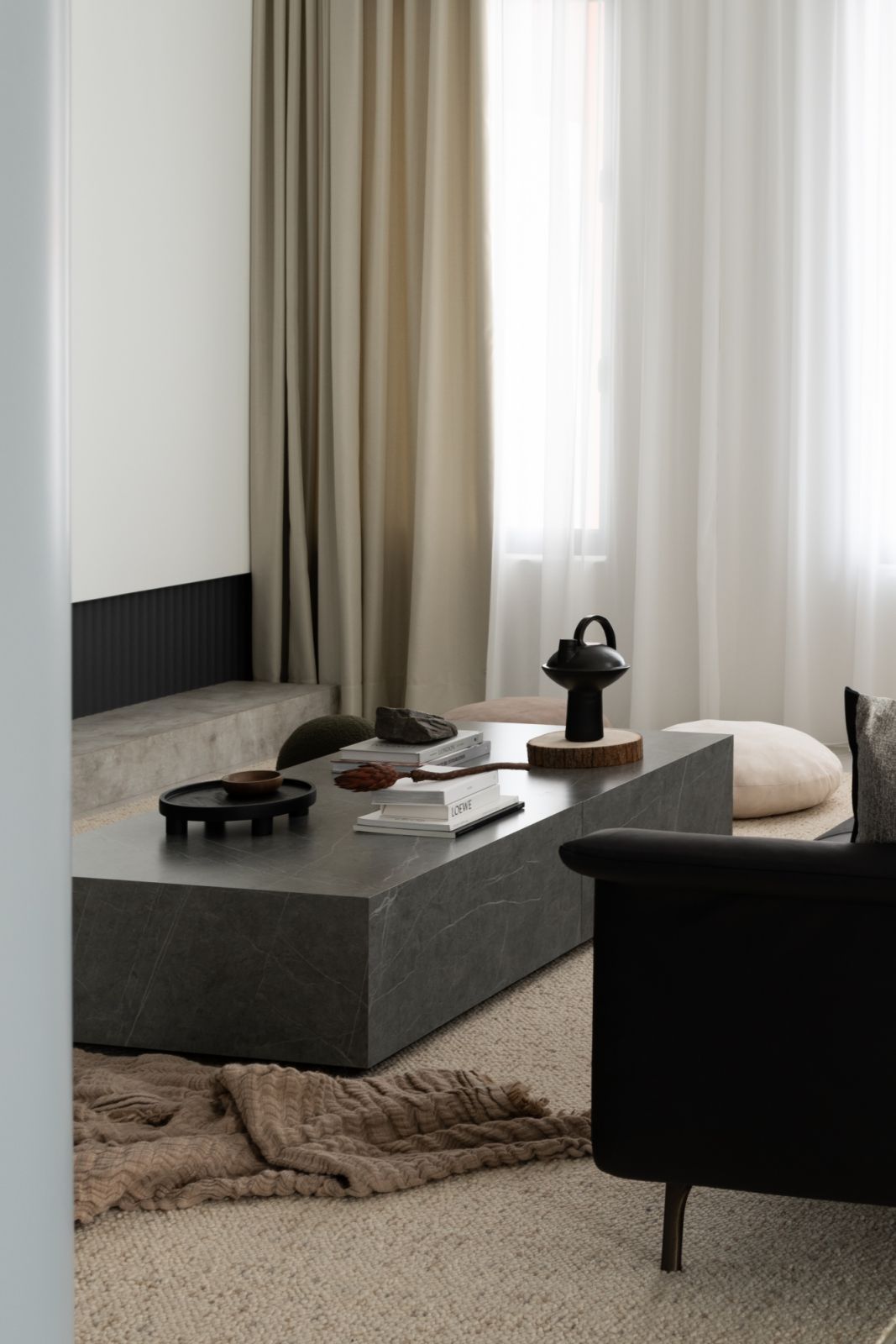 The living room has a muted palette (Photo: TWJPTO)