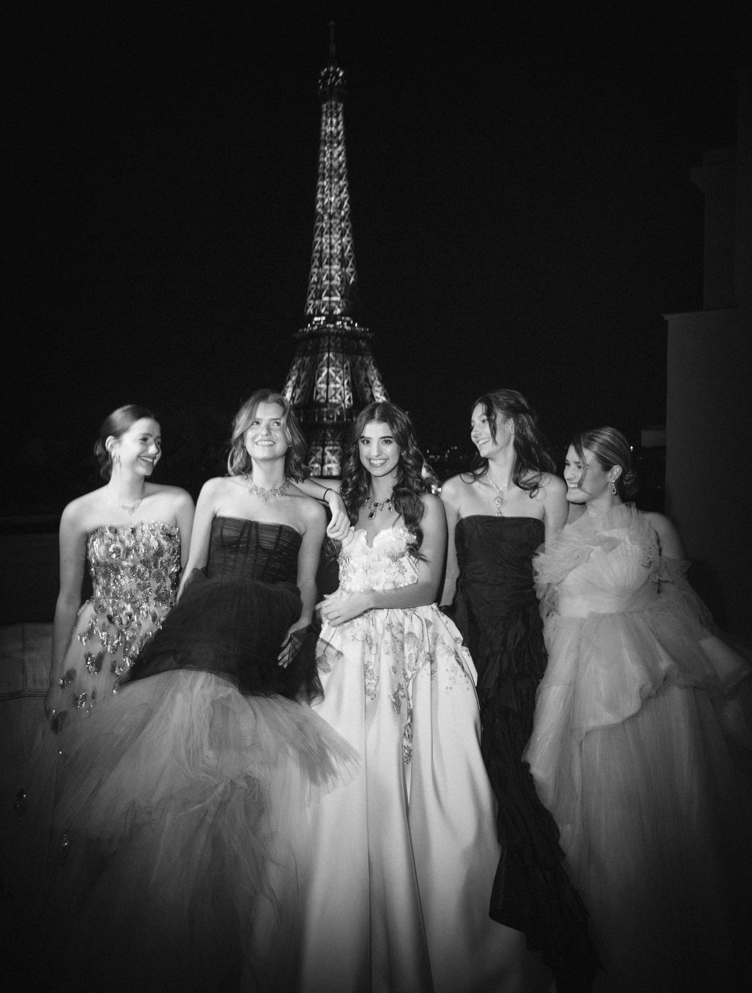 (From left) Olivia Ford Uzielli, Lara Connor, Hannah Husain, Louisa Dub and Ella McCaw pose in front of the glimmering Eiffel tower