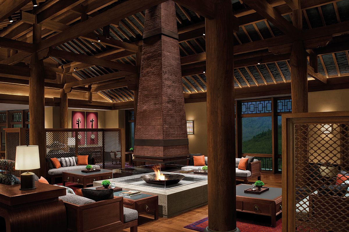 The lobby lounge of Rissai Valley, a Ritz-Carlton Reserve is a cosy zone awash in chocolatey wood tones