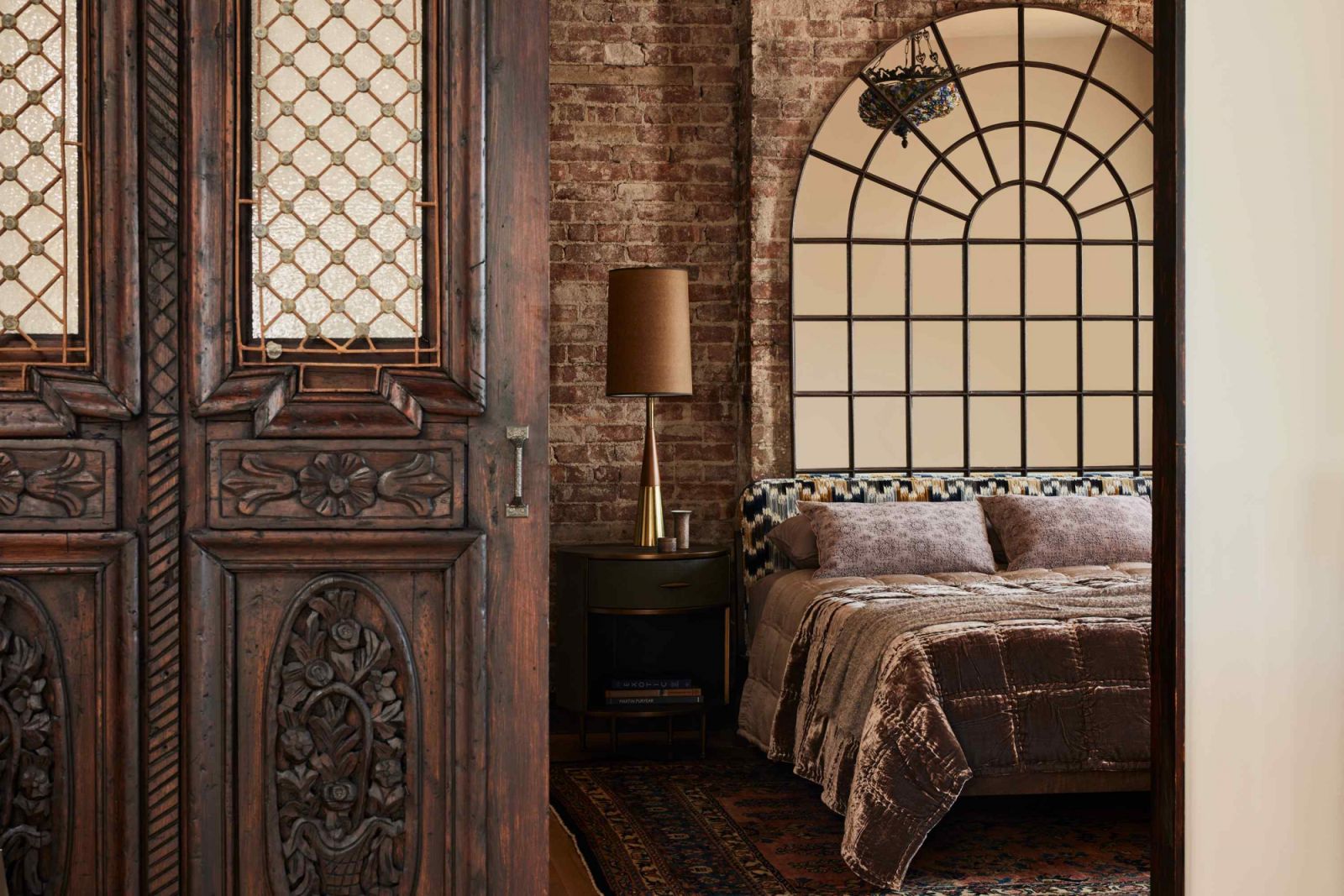 The antique door acquired in New Orleans was a prized statement piece of the home