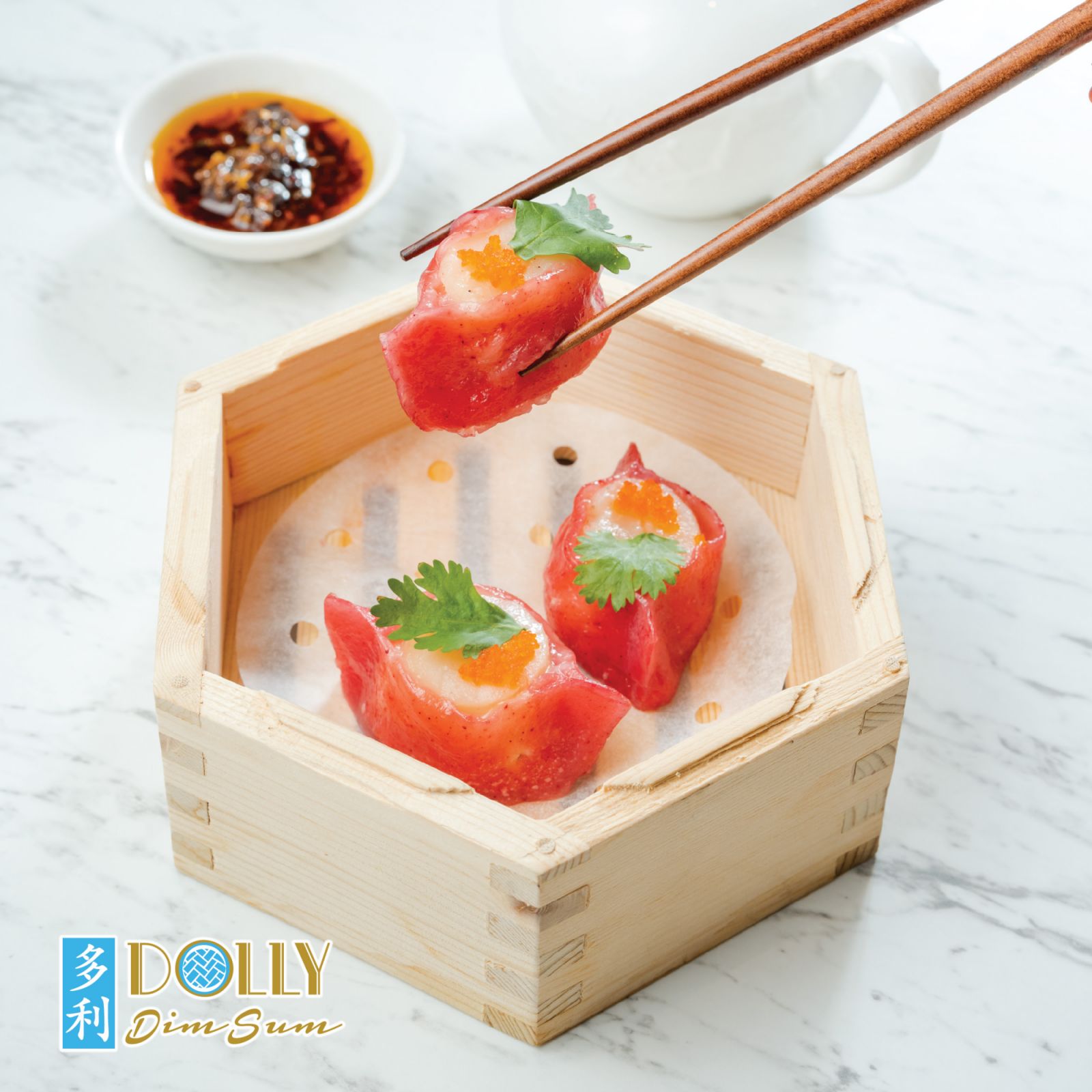Scarlet-coloured scallop and fish dumplings (Photo: Dolly Dim Sum)