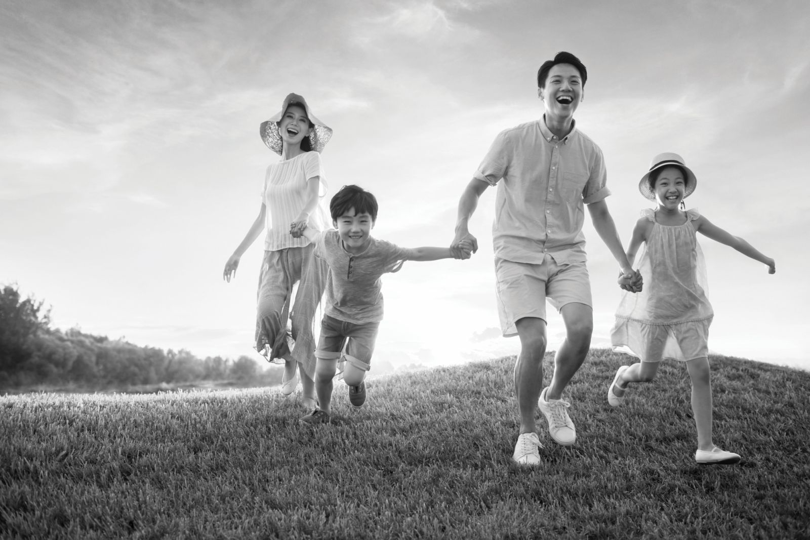 Happy young family running on meadow (Photo: GettyImages)