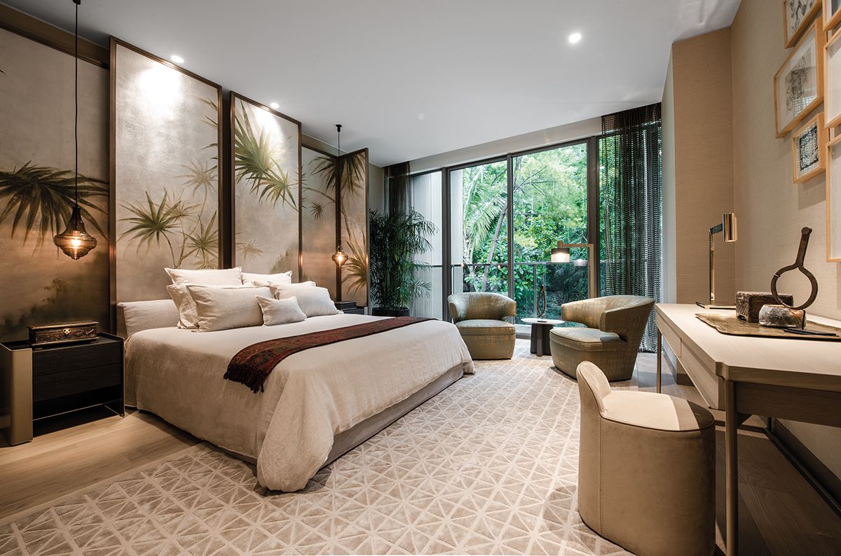 The unit’s master bedroom offers refreshing views of the foliage outdoors