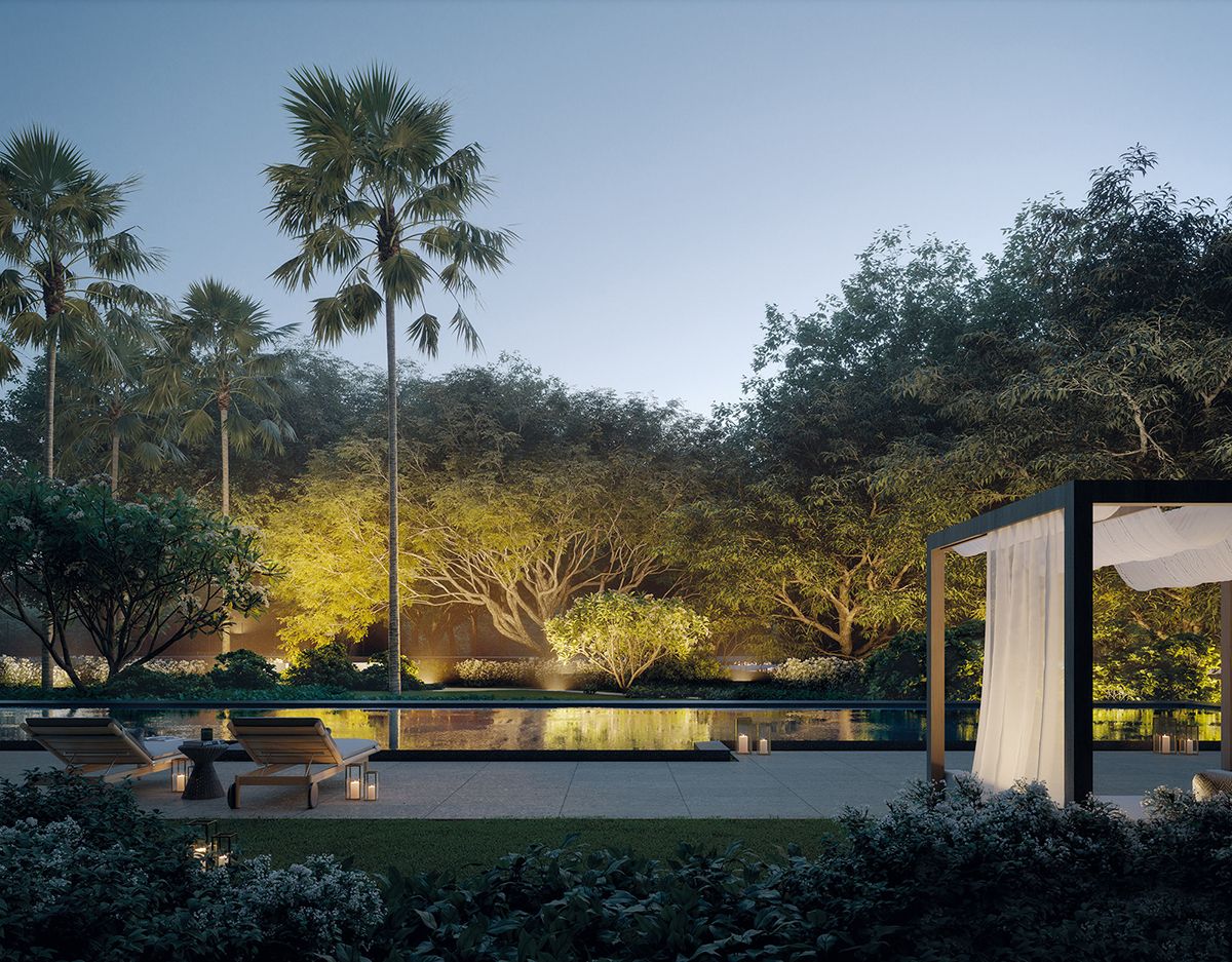 A twilight view of the poolside area and its inviting deck chairs and cabana