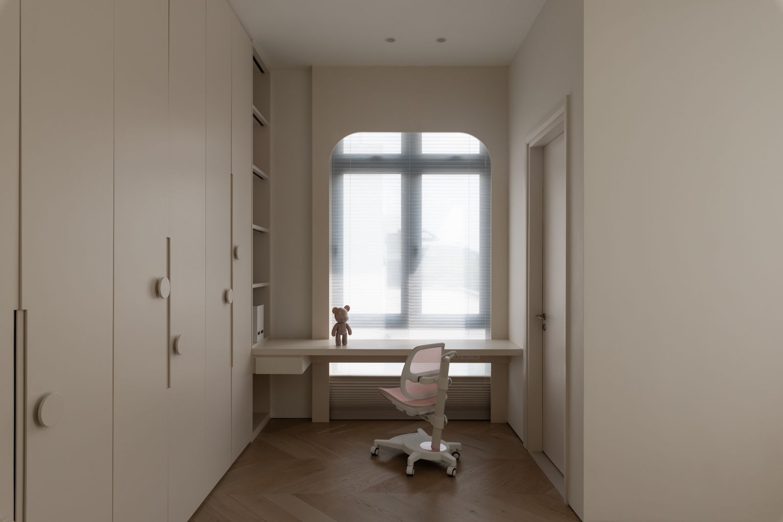 A study desk is built into the space