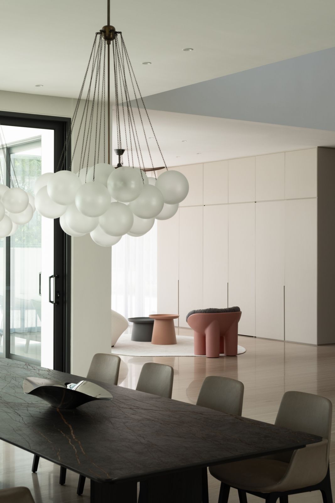 The modern chandeliers are a focal point