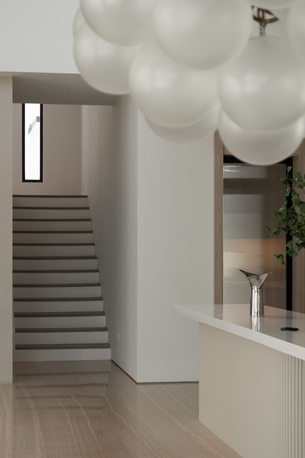 The staircase has a sculptural quality