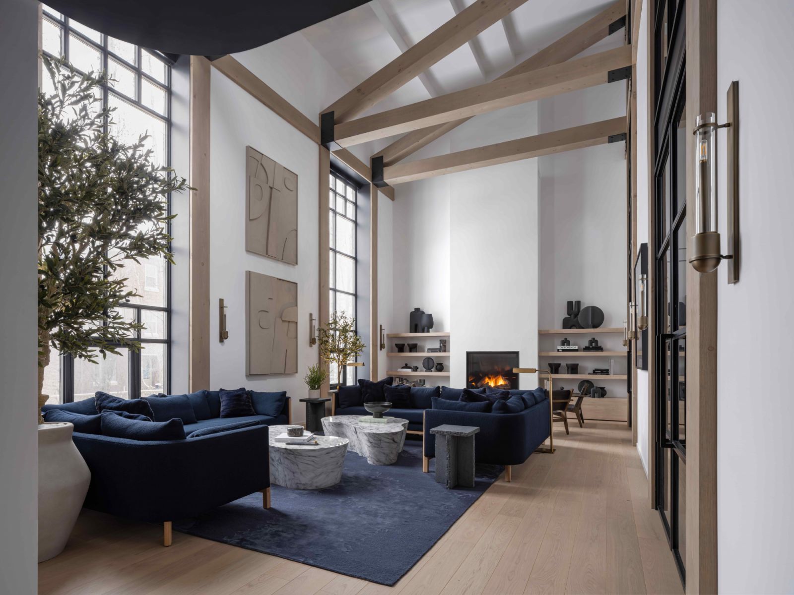The living area with a wooden A-frame that lined the 25-foot high ceiling