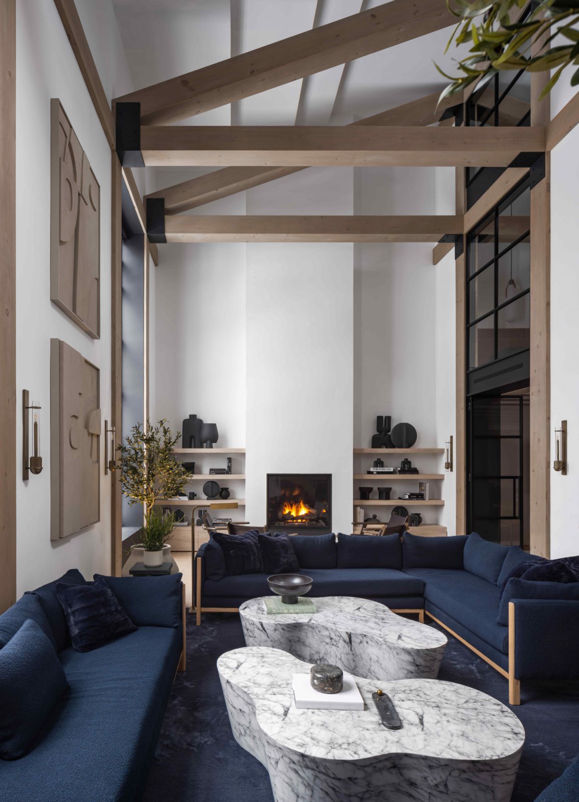 The double-storey wood A-frame structure is the key component for a rustic cottage vibe