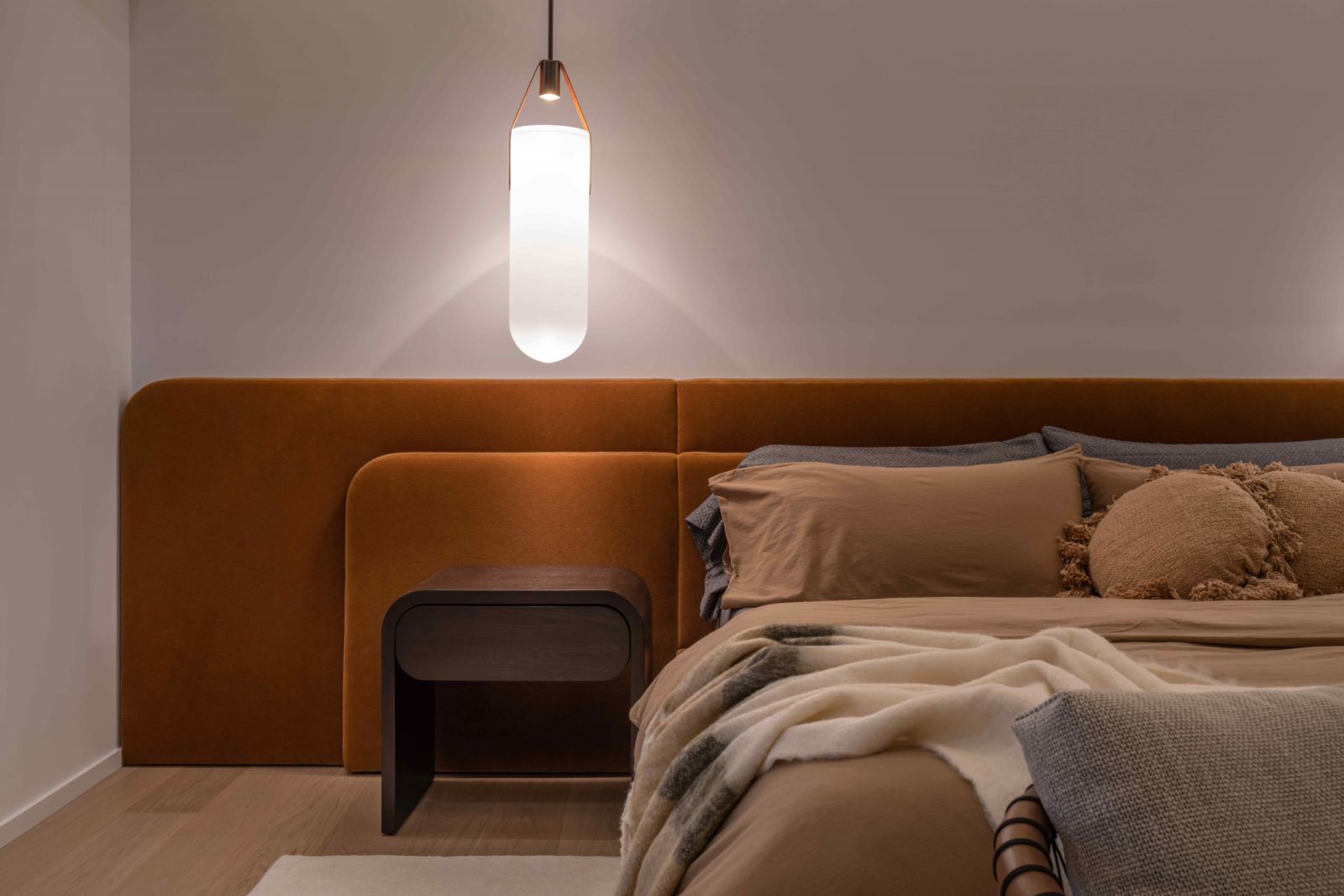 The primary bedroom exudes warmth and cosiness reminiscent of a country house