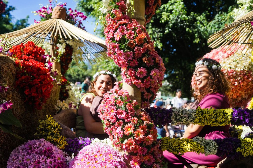 Performers sit on a float during Panagbenga Flower Festival on February 26, 2023 in Baguio, Philippines. (Photo by Zhang Xinglong/China News Service/VCG via Getty Images)