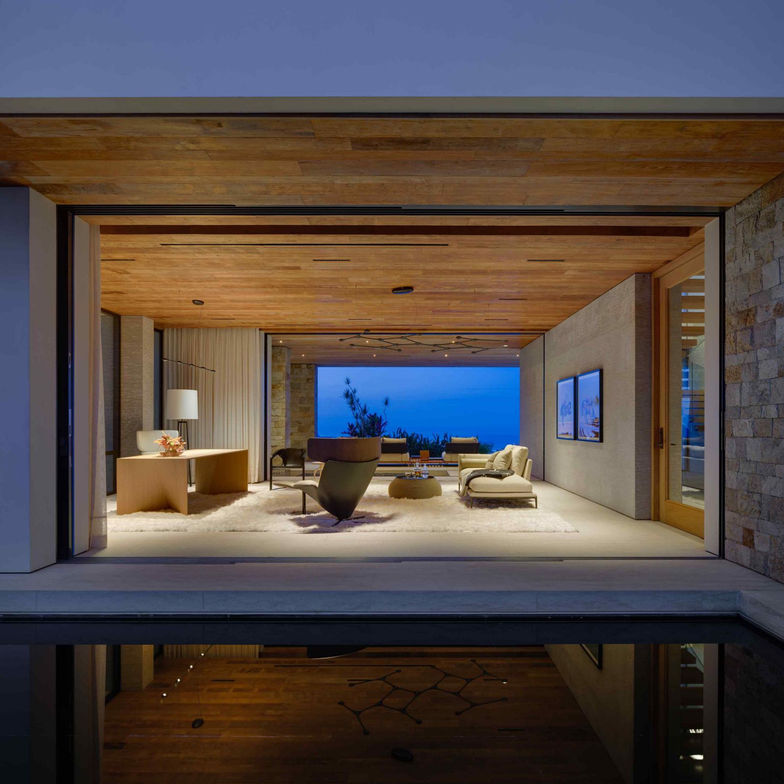 Concealed sliding doors with storm shutter systems tastefully integrated