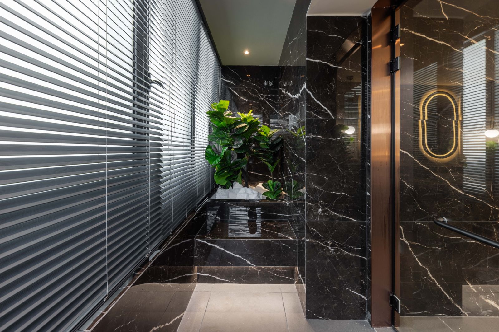 The master bathroom has a darker palette