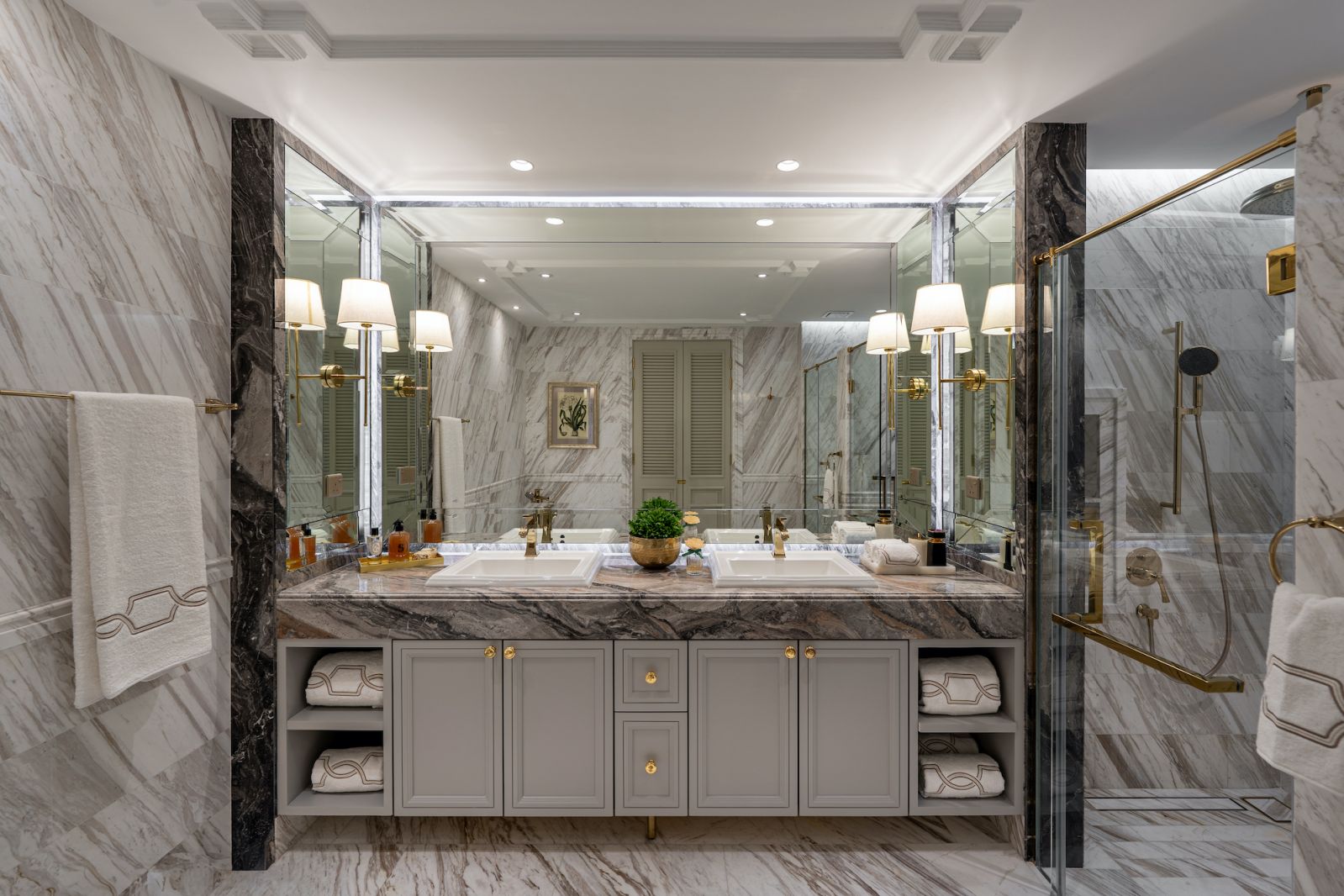 The luxury. hotel inspiration is particualrly evident in the master bathroom