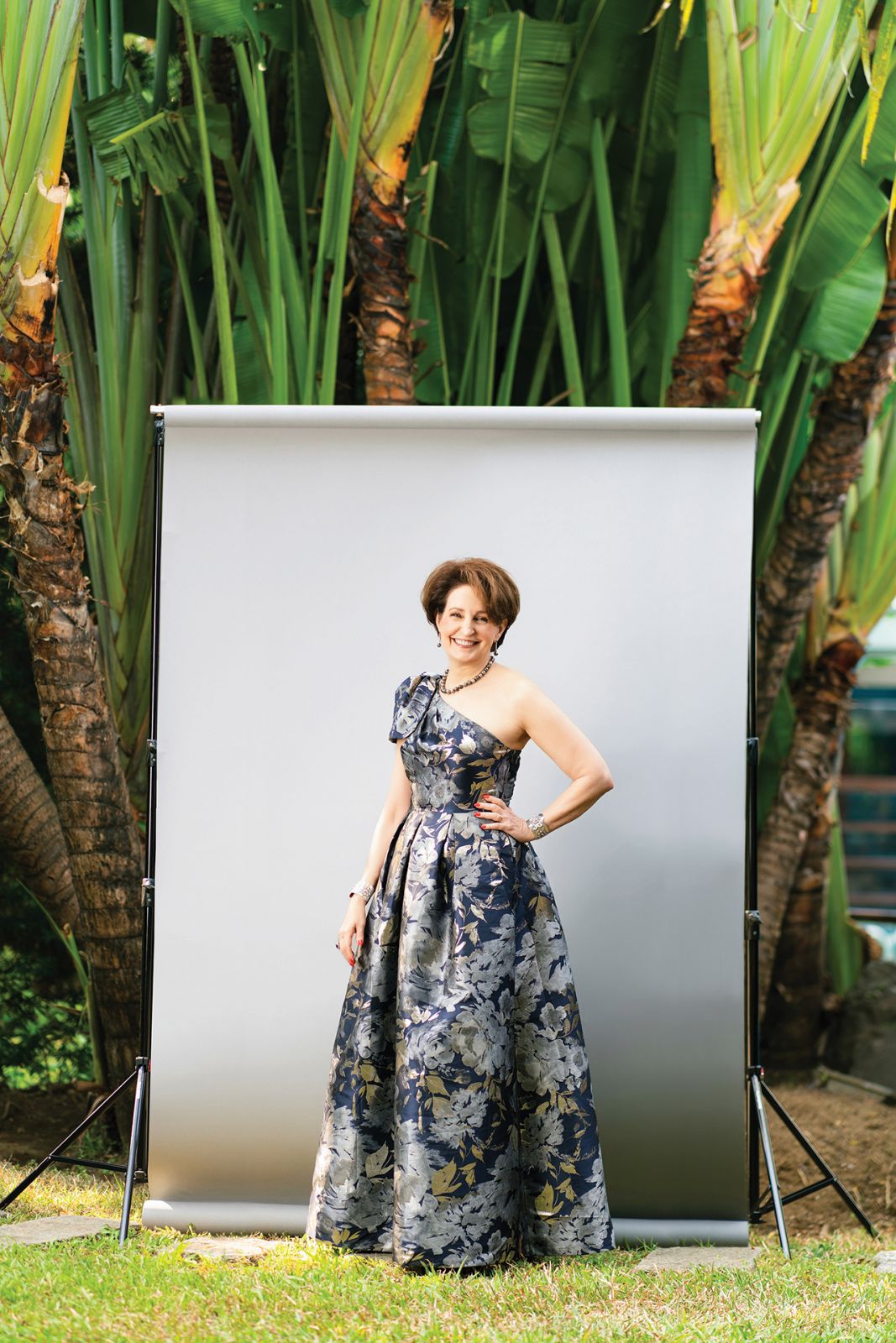 Ambassador MaryKay Carlson in an Eliza J ballgown, Tahitian pearl necklace and earrings, Mexican Taxco repoussé sterling cuffs from her mother-in-law