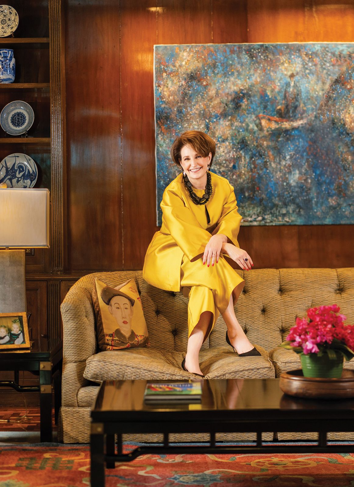 In a private sitting room, in front of The Immigrant, from Argentina. Criselda outfit, Sam Edelman shoes, onyx and sterling silver vintage Mexican earrings, necklace of black crystal, onyx and lava stones