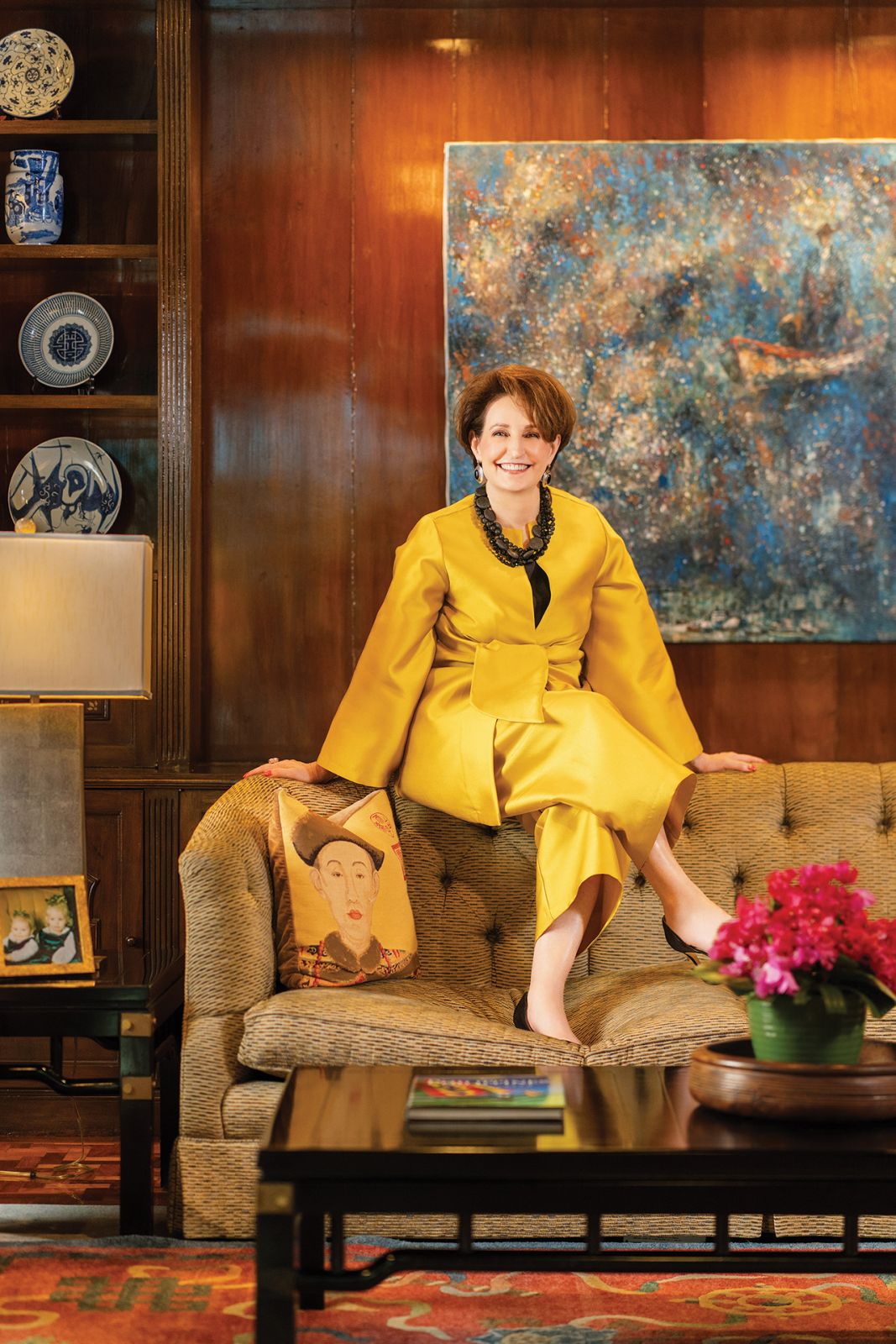In a private sitting room, in front of The Immigrant, from Argentina. Criselda outfit, Sam Edelman shoes, onyx and sterling silver vintage Mexican earrings, necklace of black crystal, onyx and lava stones