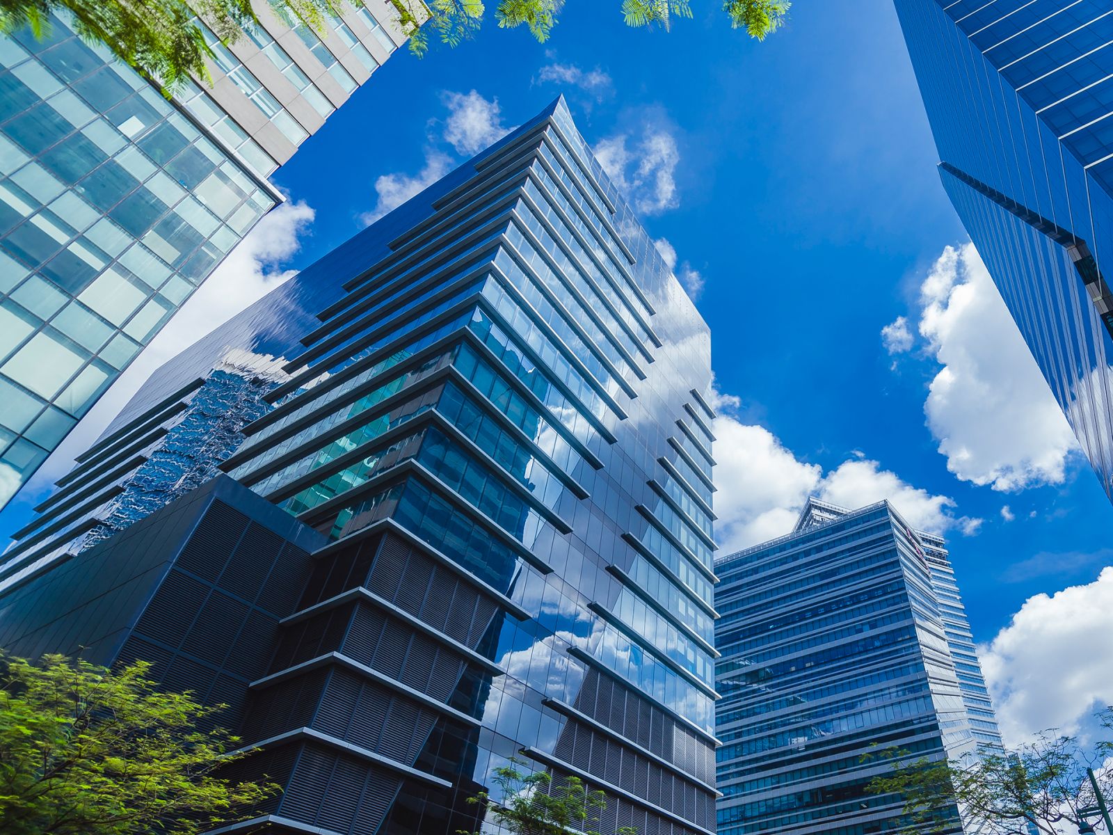 Glassy highrises along 5th avenue, Bonifacio Global City in Philippines. A modern central business district.