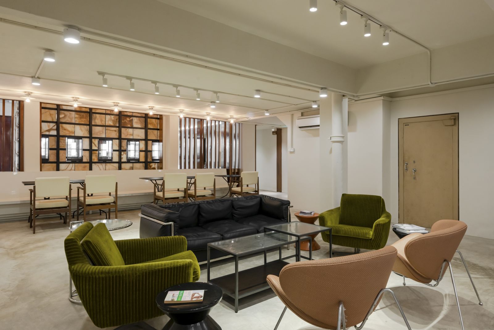 Semi-private dining spaces with reupholstered armchairs