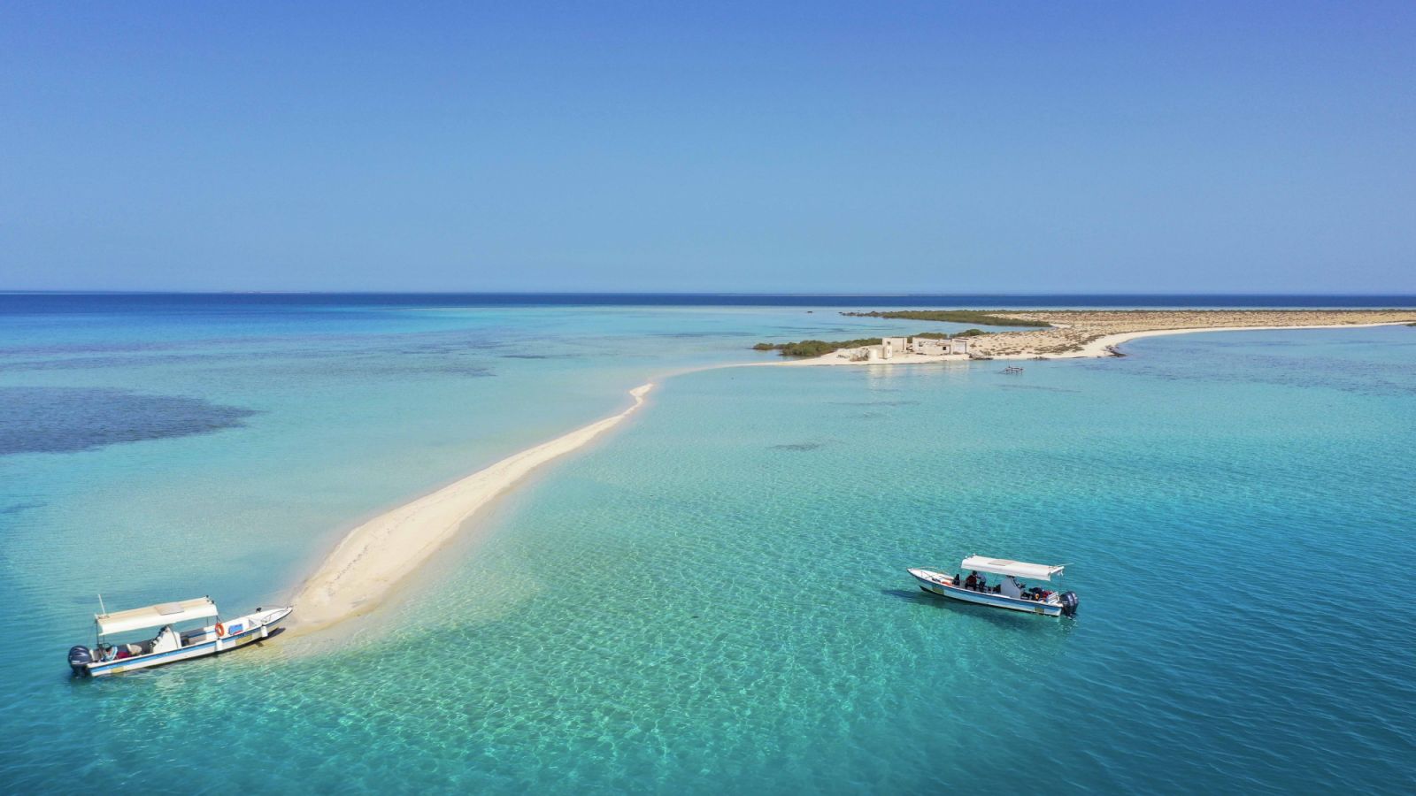 Two diving boats of the shore or a small island in the Red Sea