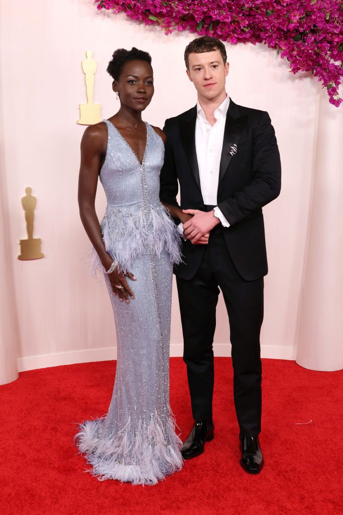 HOLLYWOOD, CALIFORNIA - MARCH 10: (L-R) Lupita Nyong'o and Joseph Quinn attend the 96th Annual Academy Awards on March 10, 2024 in Hollywood, California. (Photo by John Shearer/WireImage)