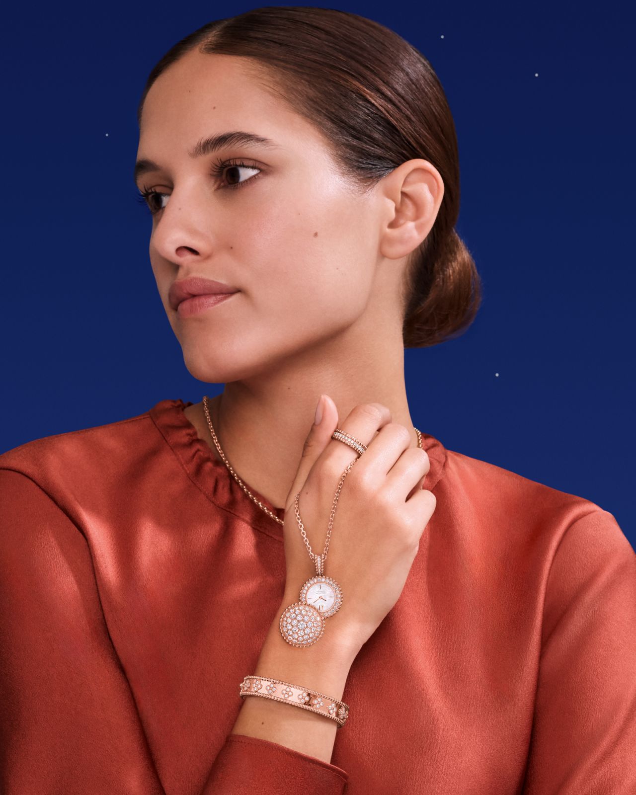 Perlée diamond rings in rose gold, Perlée secret pendant watch in rose gold, Perlée clovers bracelet in rose gold
