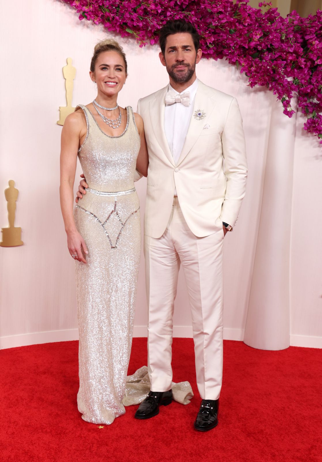HOLLYWOOD, CALIFORNIA - MARCH 10: (L-R) Emily Blunt and John Krasinski attend the 96th Annual Academy Awards on March 10, 2024 in Hollywood, California. (Photo by Kevin Mazur/Getty Images)