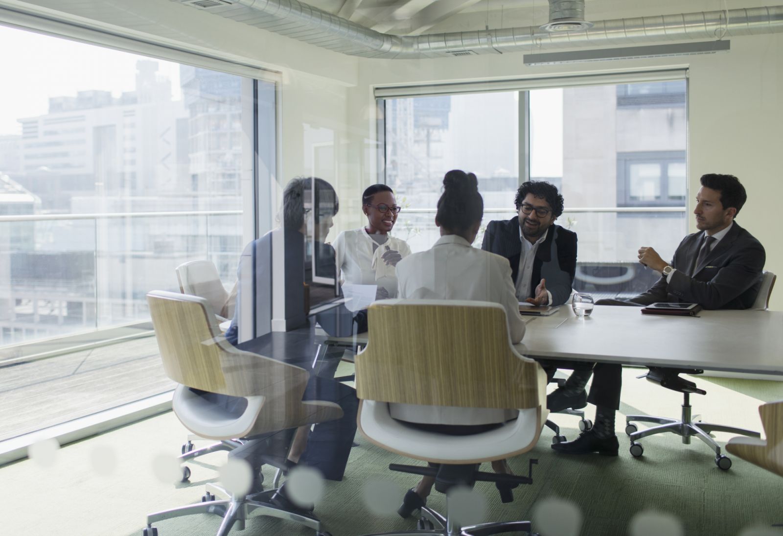 Corporate business people talking at table in conference room meeting
