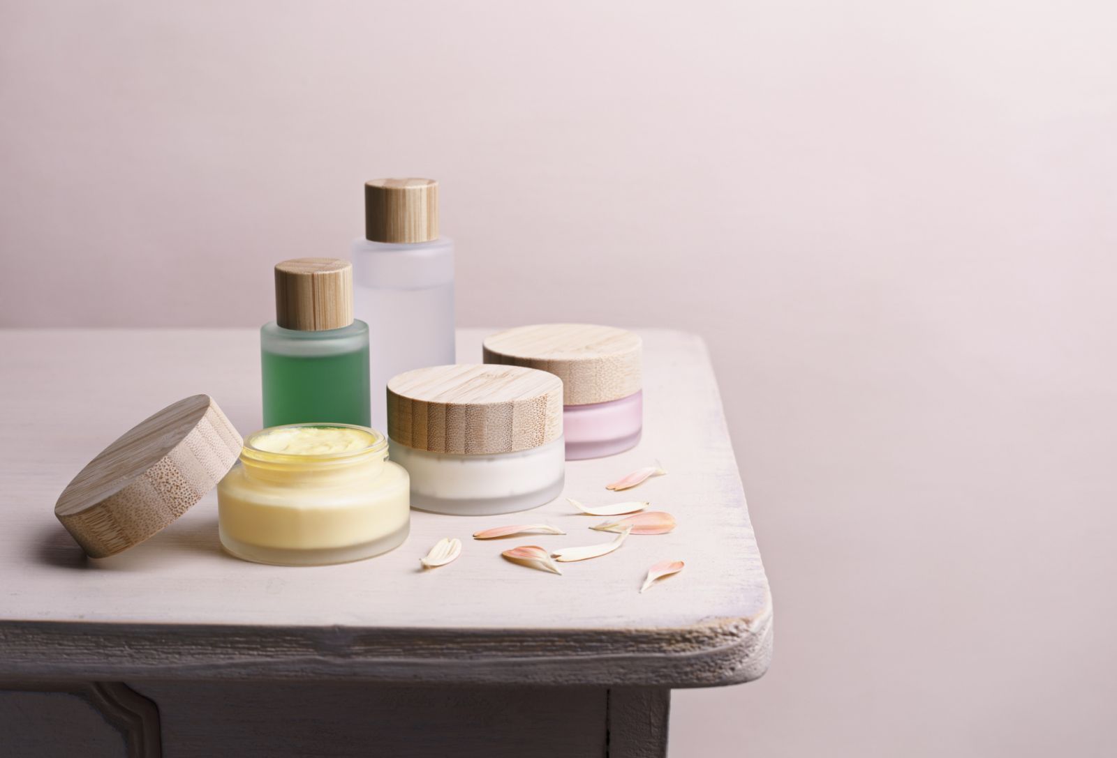 Eco friendly homemade cosmetics on a rustic table. Zero waste packaging.