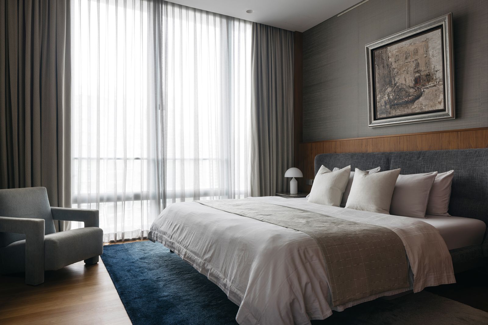 A largely restrained palette gives the master bedroom an air of restfulness