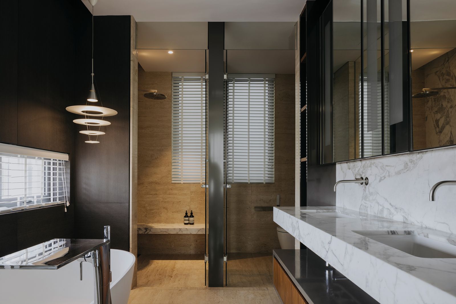 The double marble vanity increases the style quotient and functionality of the master bathroom