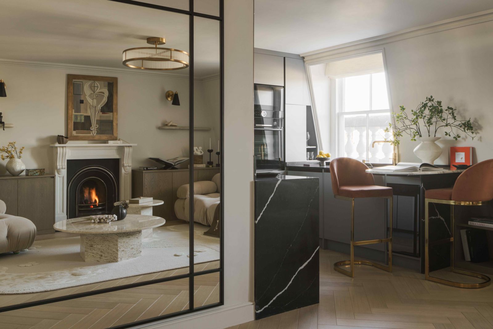 The antique mirror opens up the apartment space